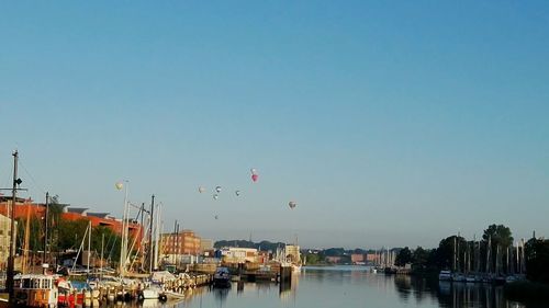 Panoramic view of buildings against clear blue sky