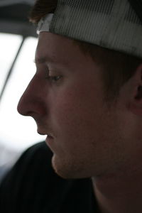 Close-up portrait of young man looking away