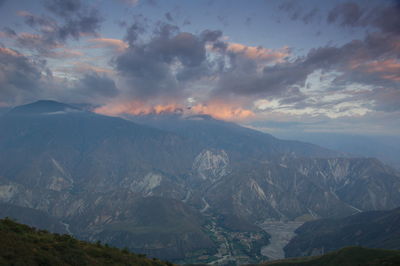 Scenic view of mountains against sky during sunset
