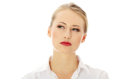 Portrait of a beautiful young woman over white background