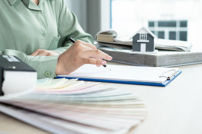 Low angle view of man working on table