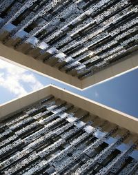 Low angle view of building roof against sky