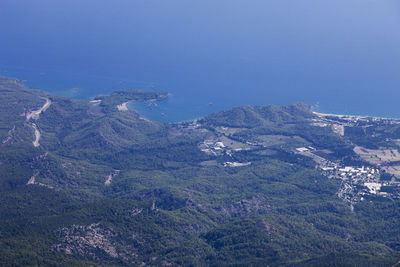 High angle view of mountains against clear blue sky