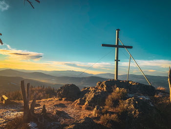 Scenic view of land against sky during sunset