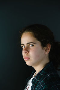 Close-up of girl against wall