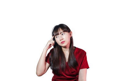 Portrait of a beautiful young woman over white background