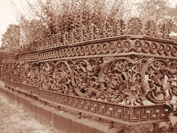 Close-up of ornate column against sky