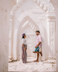 People standing against wall in building