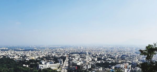 High angle view of city buildings against sky