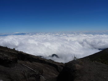 Scenic view of mountains against clear blue sky