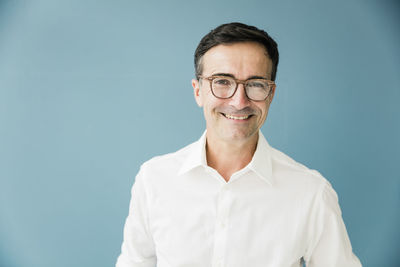 Portrait of smiling businessman wearing glasses