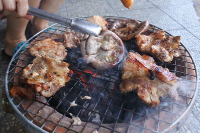 High angle view of meat on barbecue grill