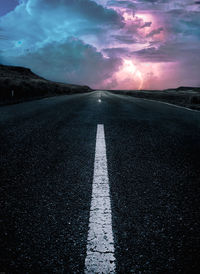 Surface level of empty road against sky