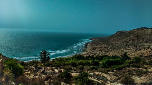 Scenic view of sea against clear blue sky