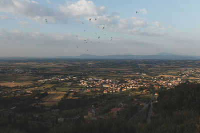 Aerial view of townscape against sky