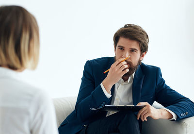 Young man sitting at home