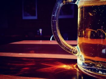 Close-up of beer glass on table