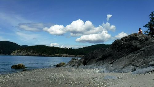 Scenic view of sea against cloudy sky