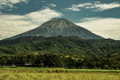 Scenic view of volcanic landscape against sky