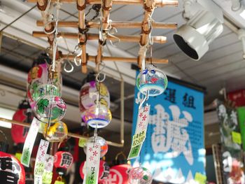 Low angle view of decorations hanging in store