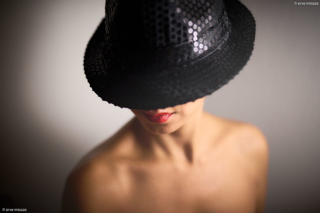one person, portrait, black, hat, adult, studio shot, headshot, fashion, indoors, clothing, young adult, women, cap, close-up, fashion accessory, gray, headgear, front view, human face