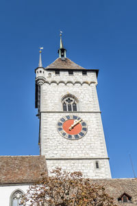 Low angle view of clock tower against sky