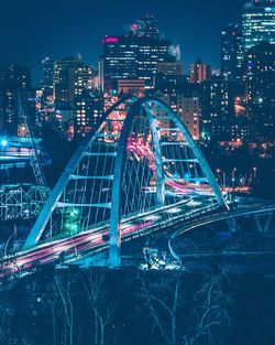 Illuminated modern buildings in city at night