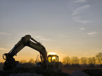 Scenic view of field against sky during sunset