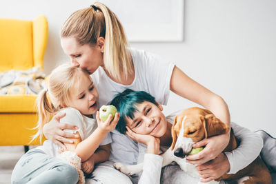 Side view of mother and daughter at home