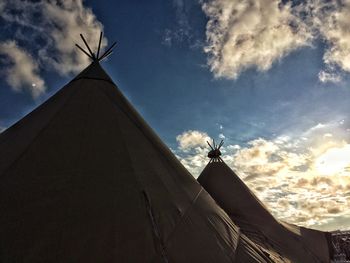 Low angle view of cross against sky