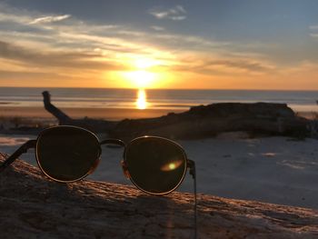 Scenic view of beach against sky during sunset