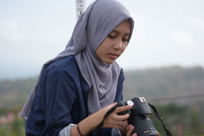 Young woman looking at camera
