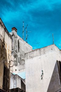 Low angle view of building against blue sky