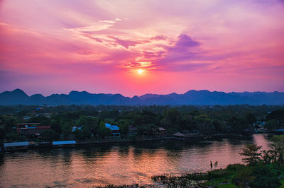 Scenic view of lake against romantic sky at sunset