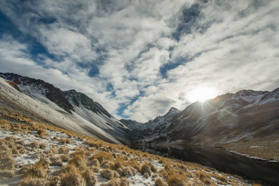 Scenic view of snowcapped mountains against sky