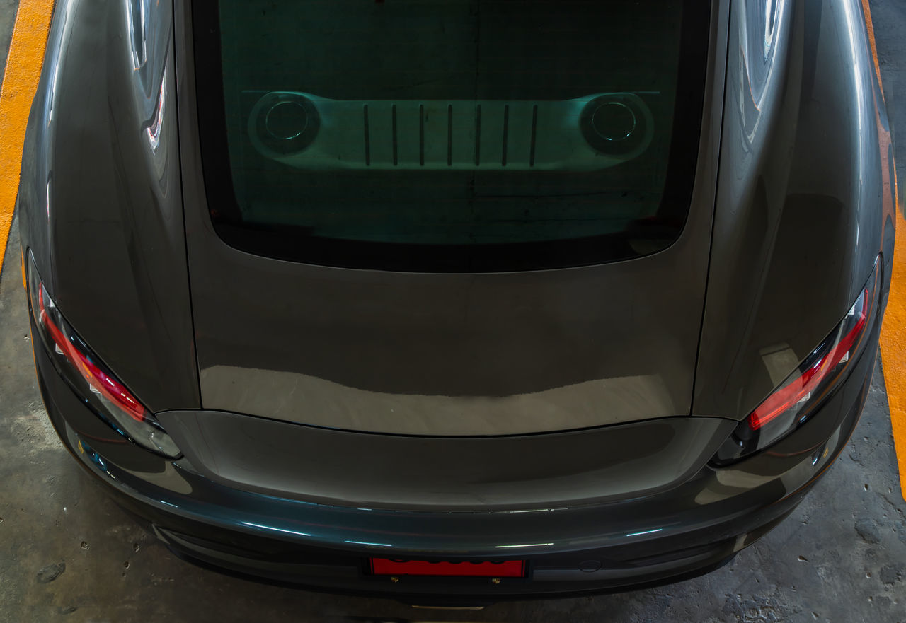 CLOSE-UP OF VINTAGE CAR ON MIRROR