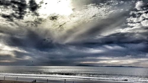 Scenic view of sea against cloudy sky