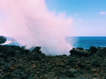 Waves breaking on rocks