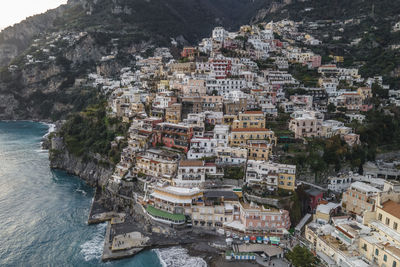 High angle view of townscape by sea