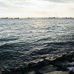 Scenic view of sea against cloudy sky