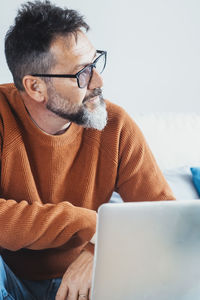 Young man using laptop at home