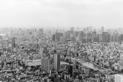 High angle view of modern buildings in city against sky