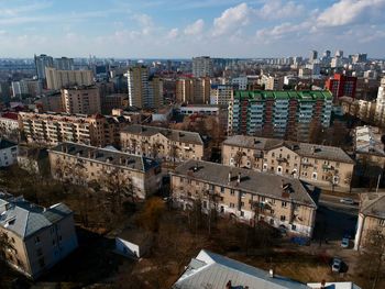 High angle view of city buildings against sky