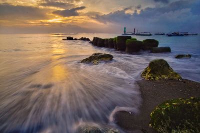 Scenic view of sea against sky during sunset