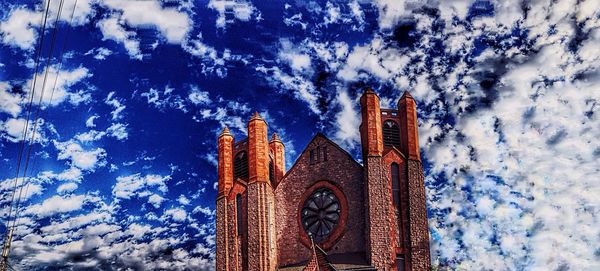 Low angle view of temple against blue sky