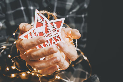 Close-up of woman hand holding decoration