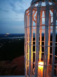 Close-up of illuminated building against sky