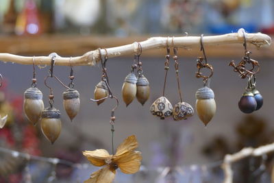 Close-up of decorations hanging at market stall