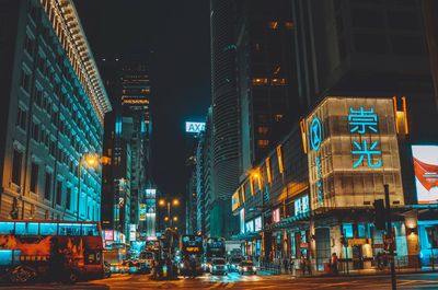 Illuminated buildings in city at night