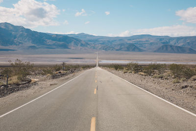 Road amidst landscape against sky